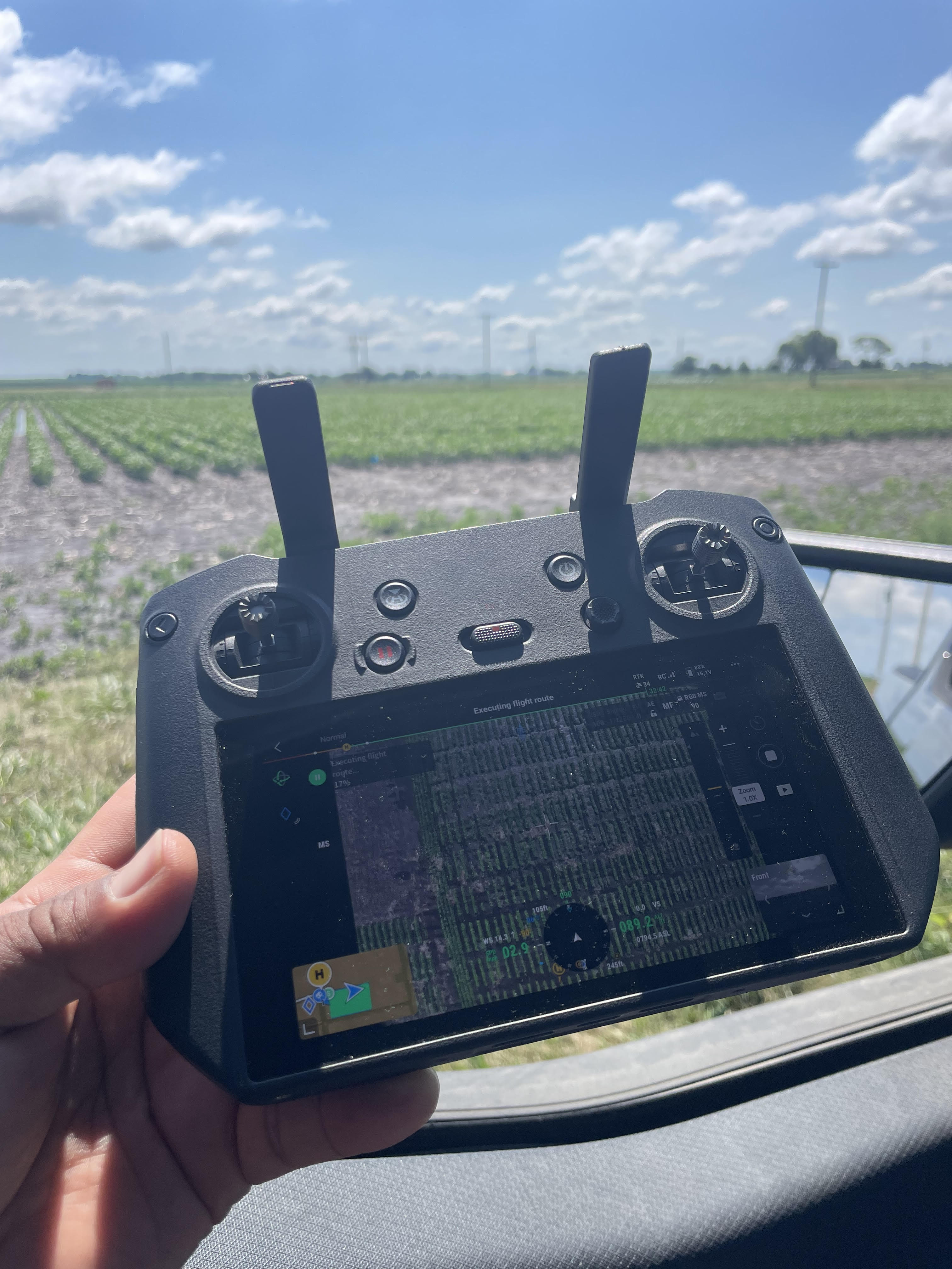 DJI Mavic 3 controller showing UAV flight planning interface over soybean field